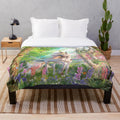 Enchanting unicorn-themed plush blanket featuring a fantasy forest scene with butterflies and rainbows