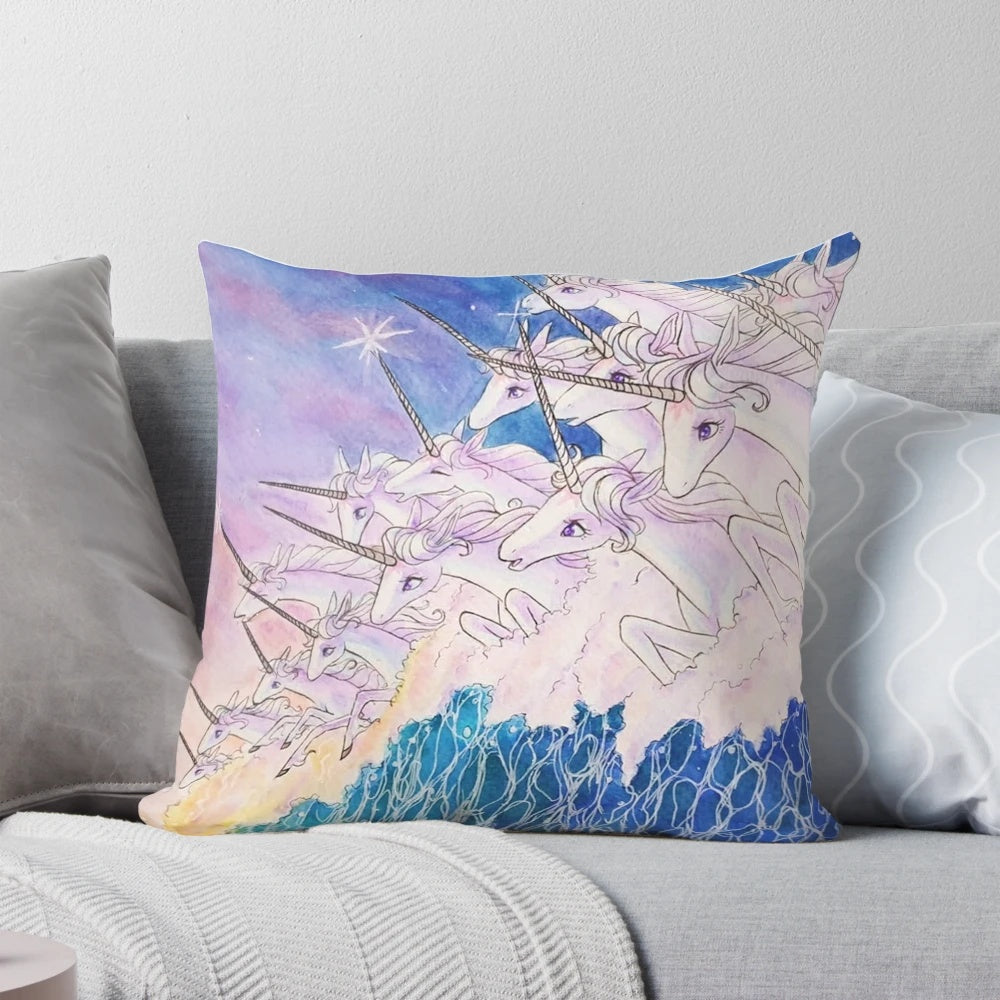 Decorative pillow featuring a whimsical unicorn swimming in a vibrant ocean scene, inspired by the classic fantasy novel "The Last Unicorn".