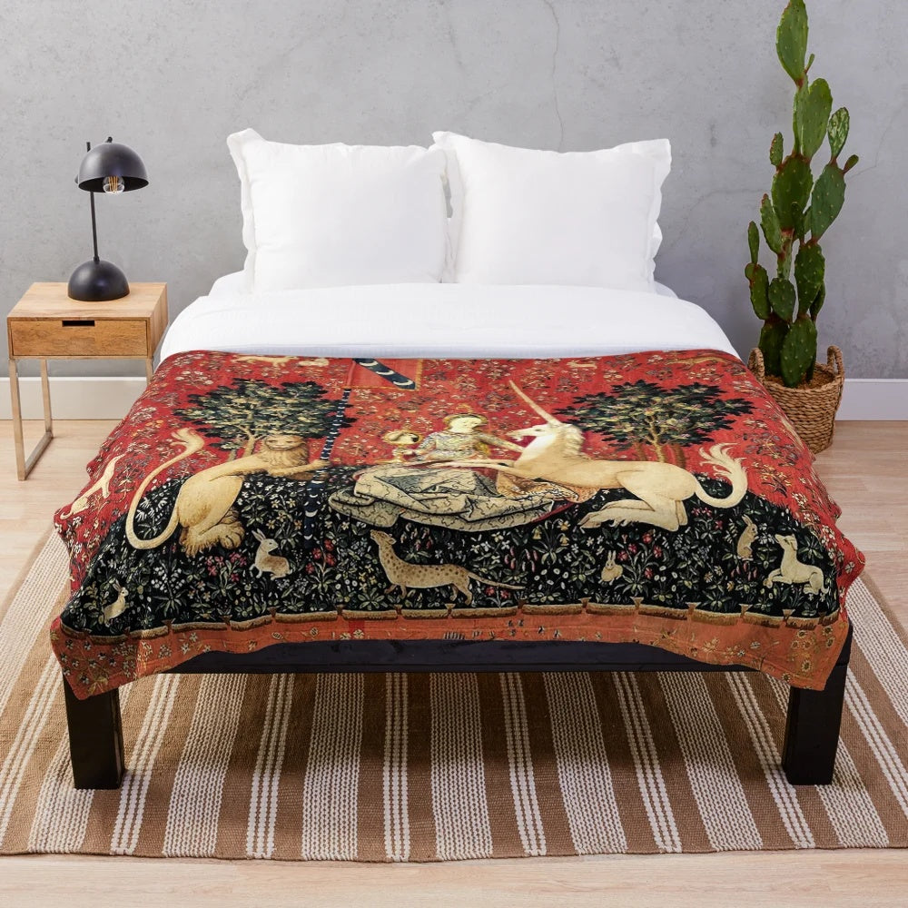 Soft, luxurious plush blanket featuring a majestic unicorn surrounded by lush greenery and elegant floral motifs