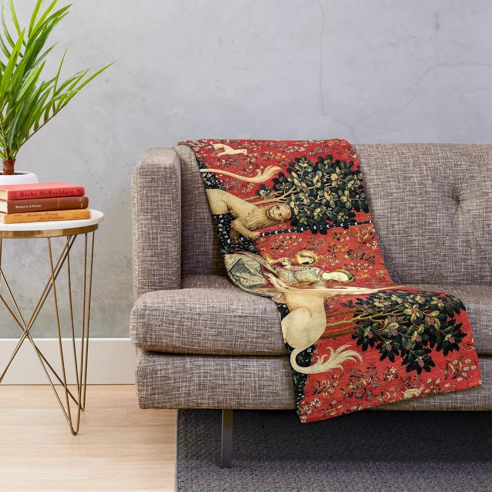 Soft, luxurious plush blanket featuring a majestic unicorn surrounded by lush greenery and elegant floral motifs