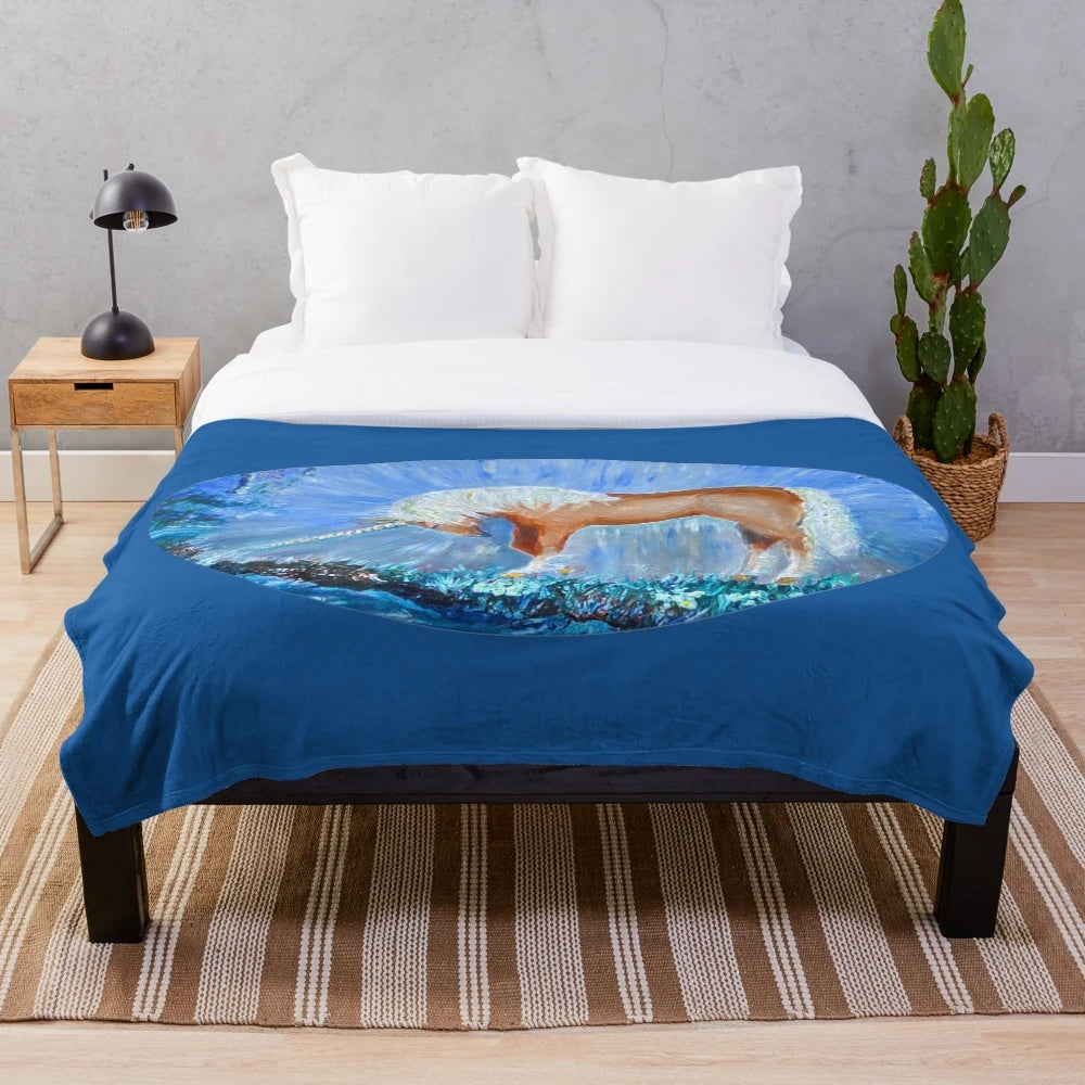 Plush blanket featuring a whimsical painting of a unicorn in a misty forest