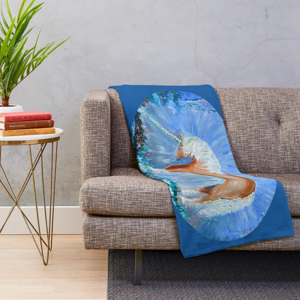 Plush blanket featuring a whimsical painting of a unicorn in a misty forest