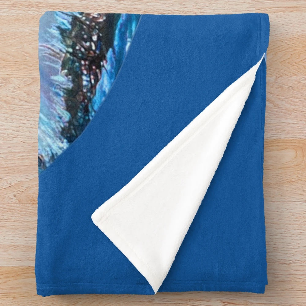 Plush blanket featuring a whimsical painting of a unicorn in a misty forest