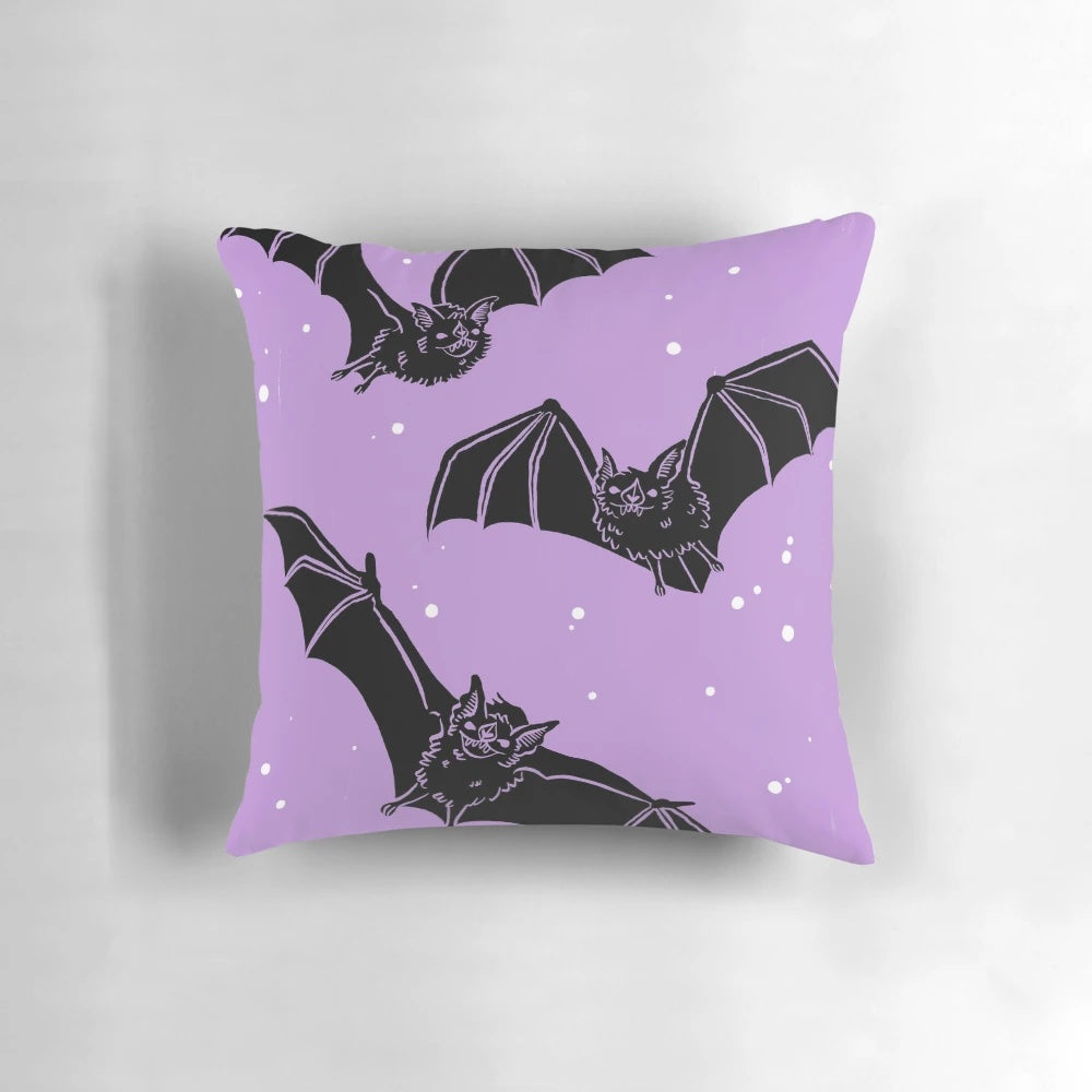 Violet pillow with a whimsical bat design, perfect for gothic and pastel goth home decor