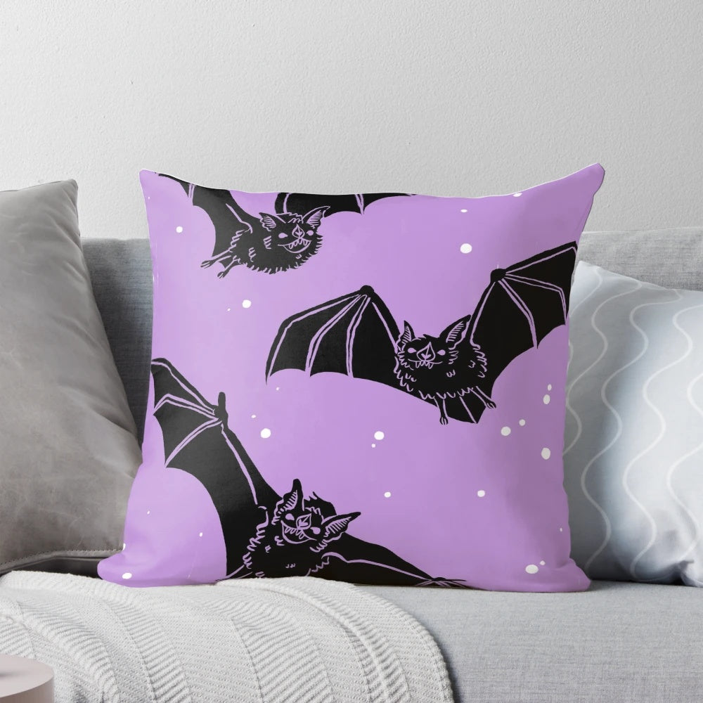 Violet pillow with a whimsical bat design, perfect for gothic and pastel goth home decor