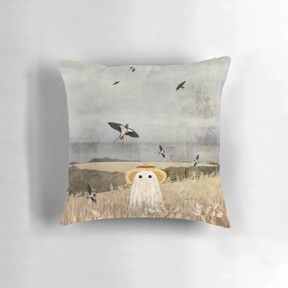A cozy pillow featuring a whimsical scene of swallows flying over a wheat field, with a touch of ghostly elements.
