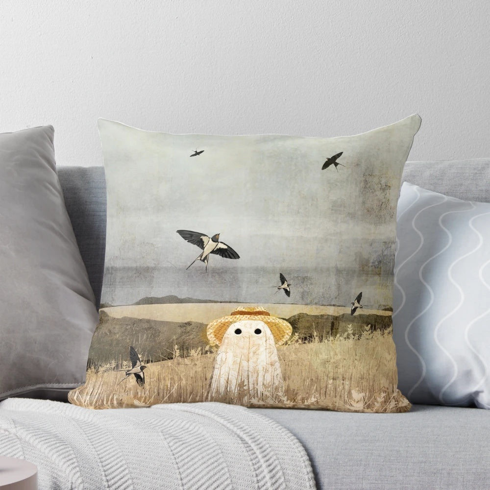 A cozy pillow featuring a whimsical scene of swallows flying over a wheat field, with a touch of ghostly elements.