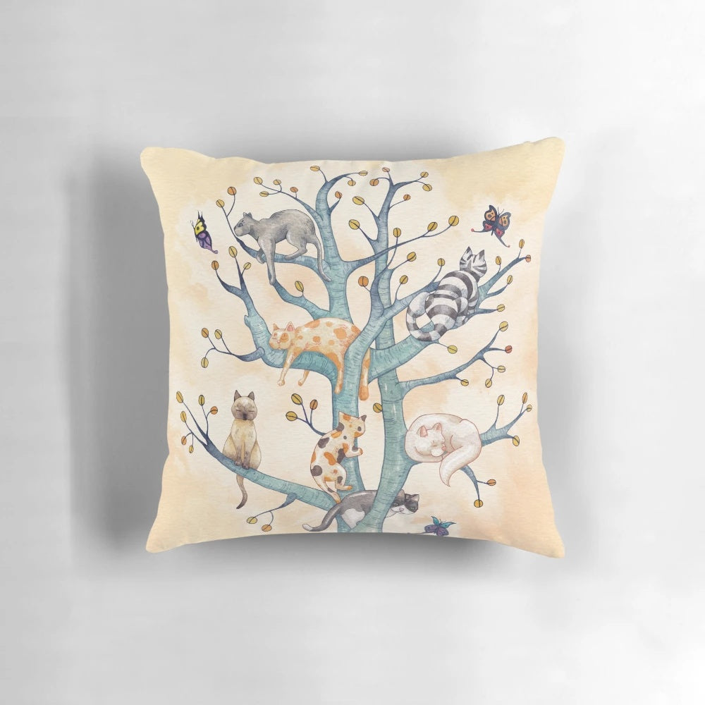 Vibrant watercolor illustration of cats playing and resting in a whimsical tree of life design, featured on a plush pillow.