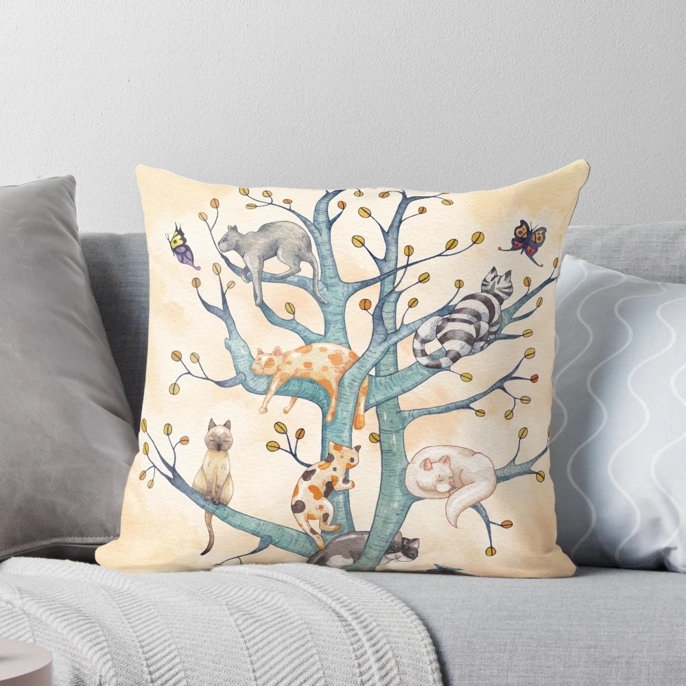 Vibrant watercolor illustration of cats playing and resting in a whimsical tree of life design, featured on a plush pillow.