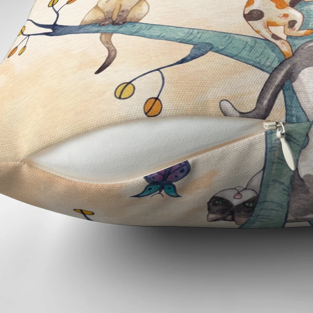 Vibrant watercolor illustration of cats playing and resting in a whimsical tree of life design, featured on a plush pillow.