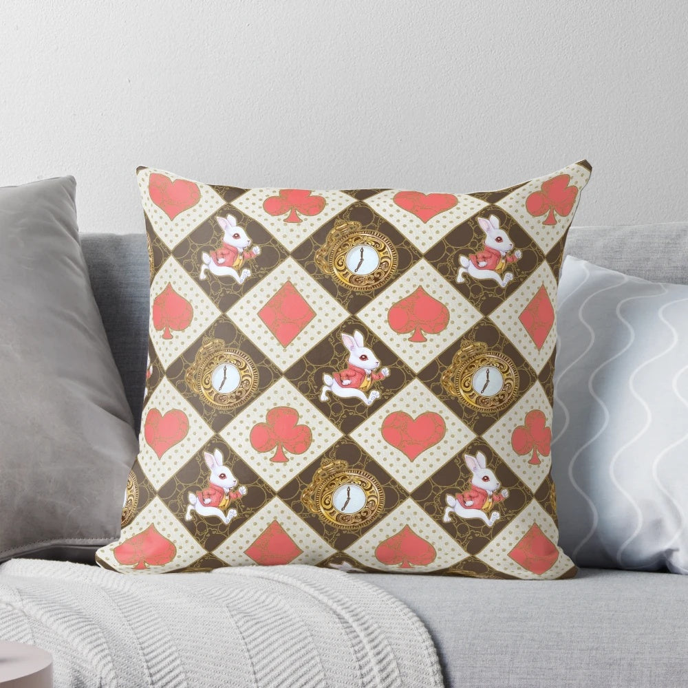 A soft, white rabbit-themed pillow with a whimsical, watercolor-style pattern of hearts, spades, and a pocket watch.