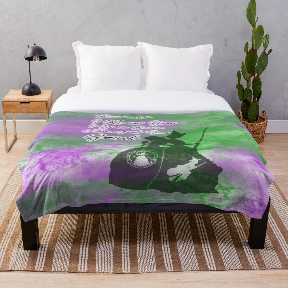 Wicked-inspired plush blanket with silhouettes of Elphaba and Glinda