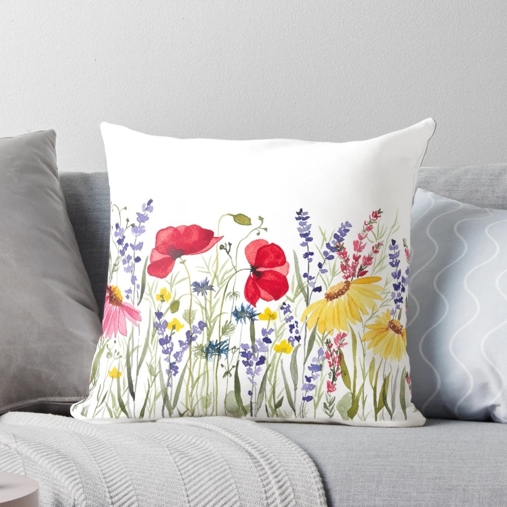 Vibrant wildflowers blooming in a meadow, captured in a cozy and stylish throw pillow