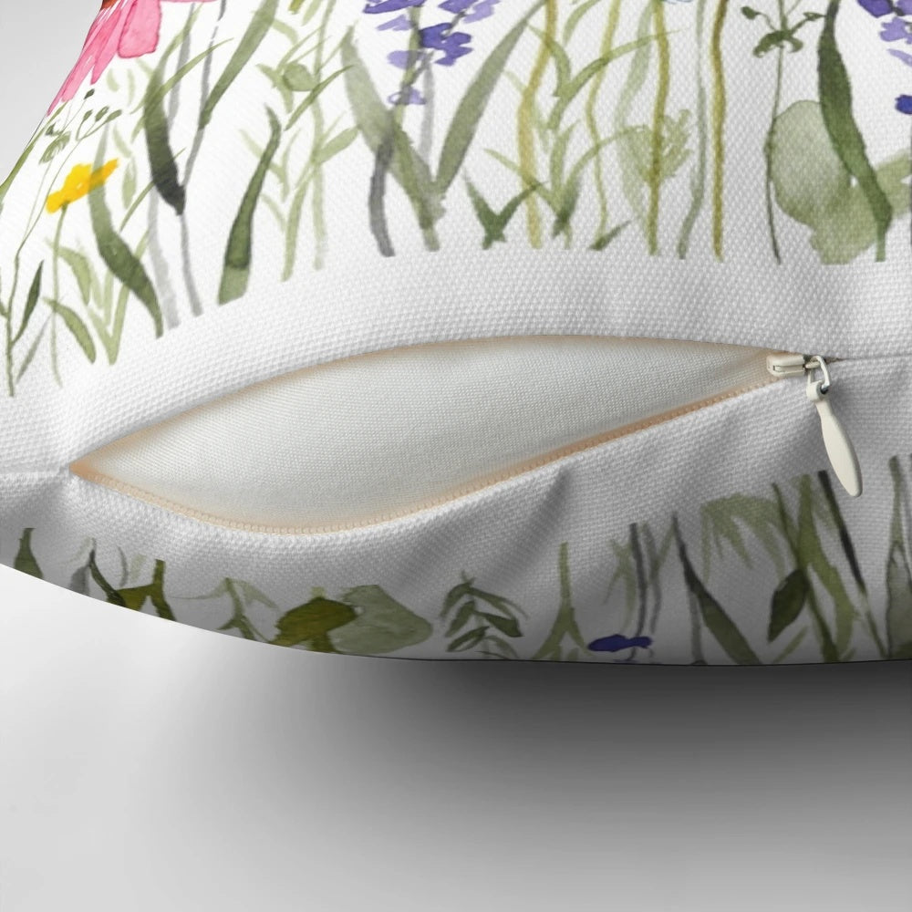 Vibrant wildflowers blooming in a meadow, captured in a cozy and stylish throw pillow