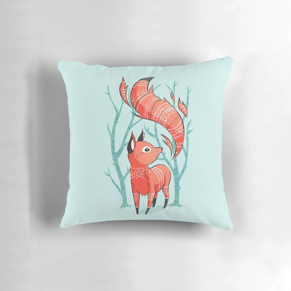 Whimsical winter fox decorative pillow with blue and red accents