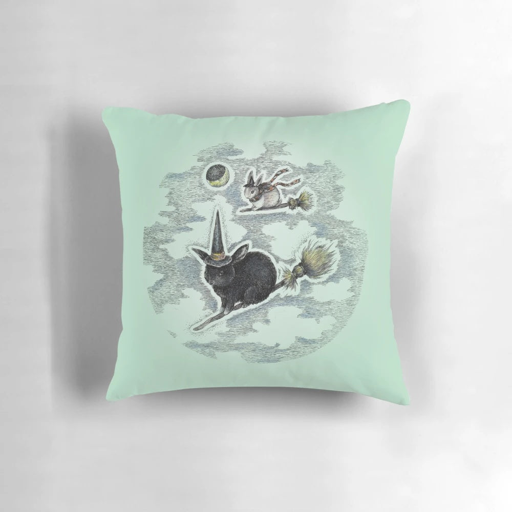Whimsical witch bunny pillow with a full moon and gothic design