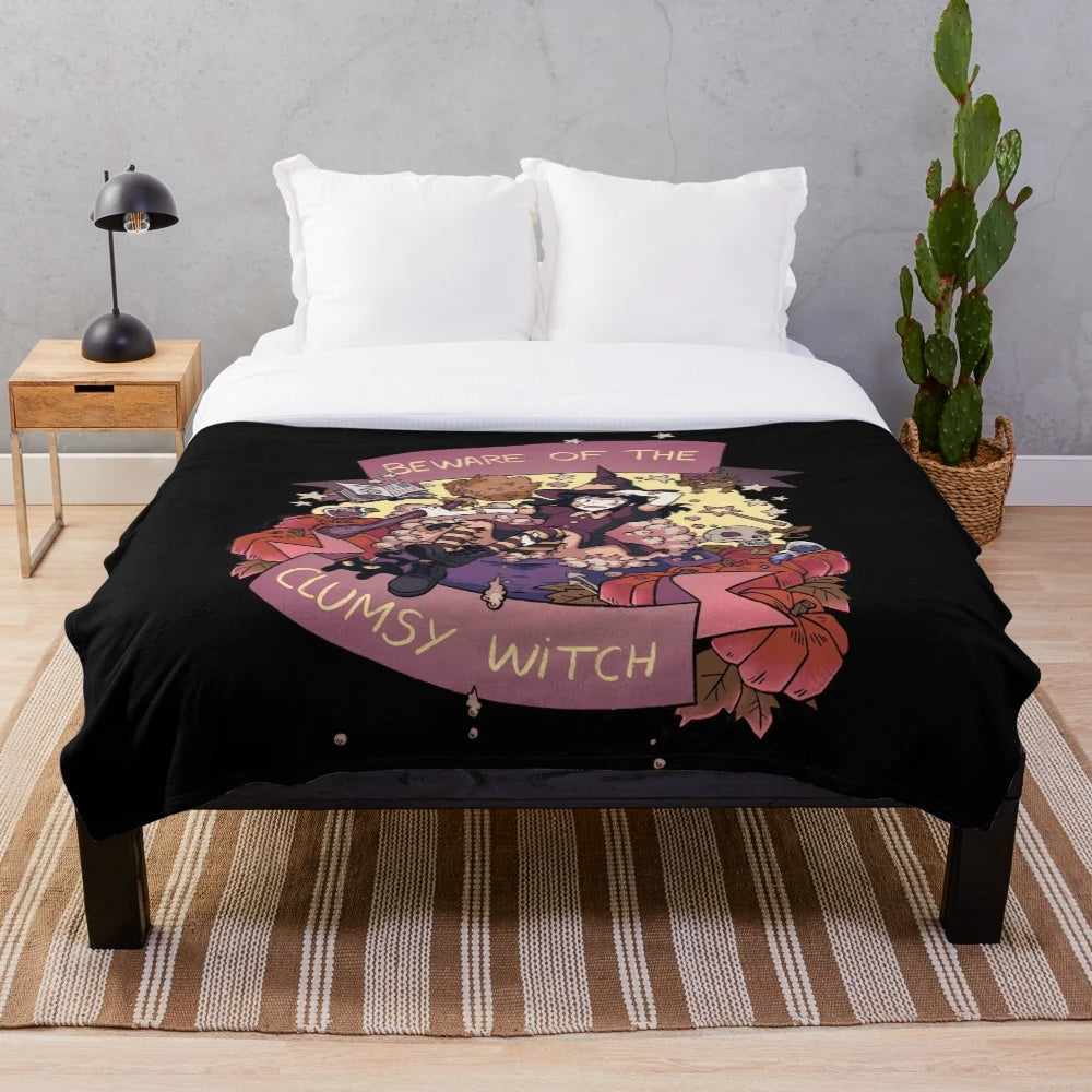 Plush blanket featuring a cute and clumsy witch character from the popular webcomic