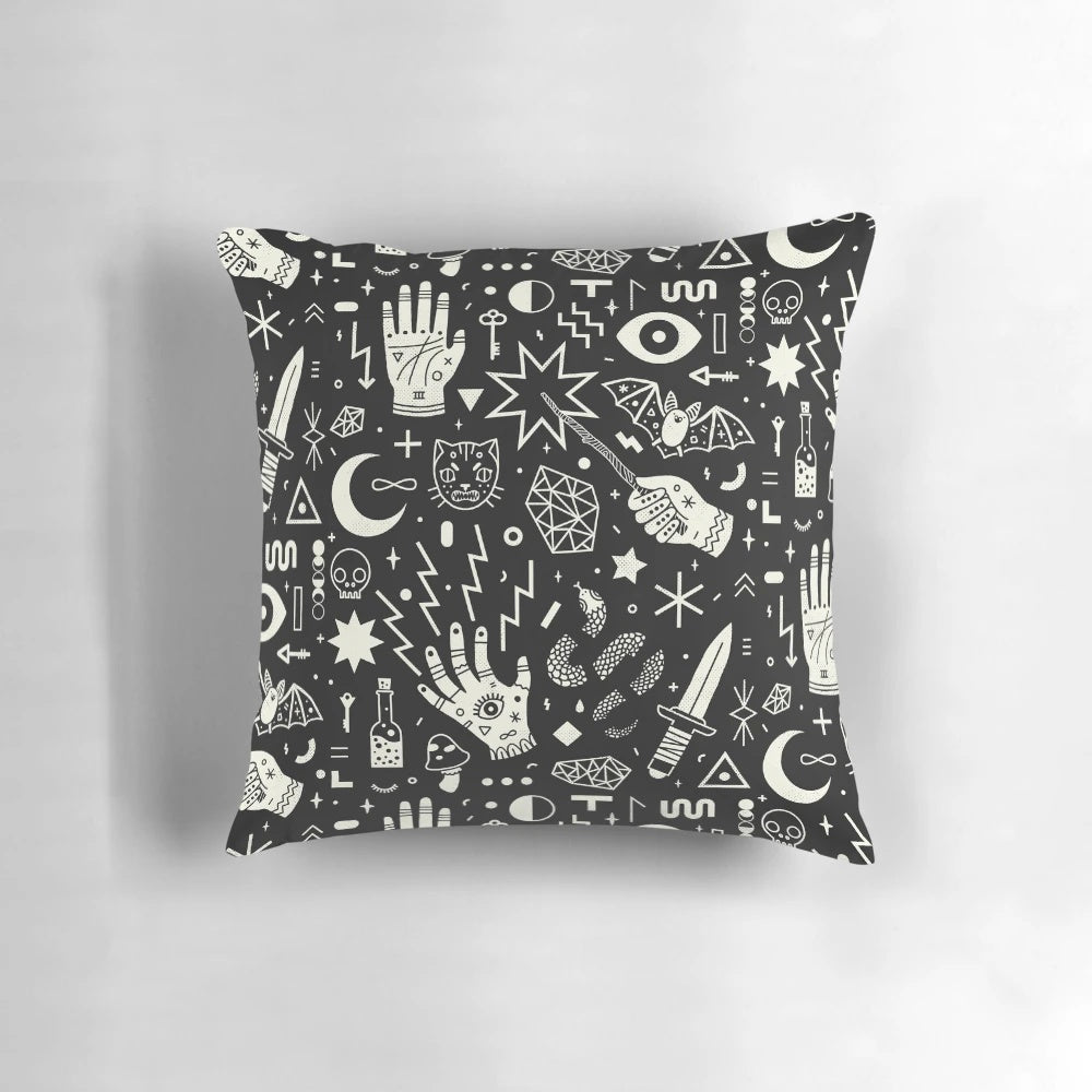 Decorative pillow featuring a witchcraft design in black and white
