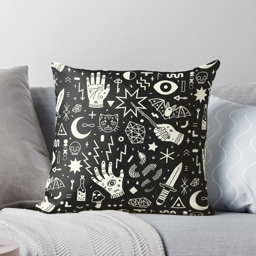 Decorative pillow featuring a witchcraft design in black and white