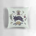 A cozy, whimsical pillow featuring a cute bunny or rabbit as a witch's familiar, perfect for home decor.