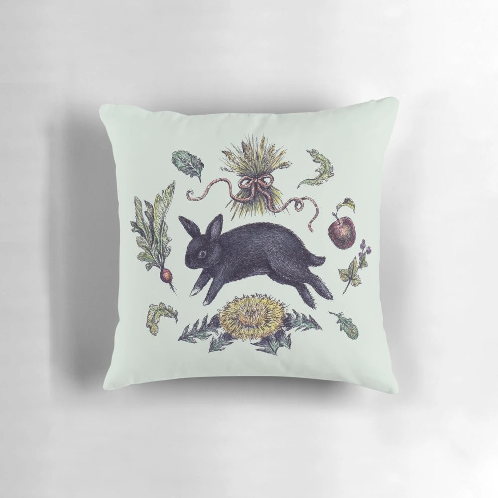 A cozy, whimsical pillow featuring a cute bunny or rabbit as a witch's familiar, perfect for home decor.