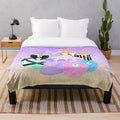 Cozy plush blanket with witch's essentials and spooky design