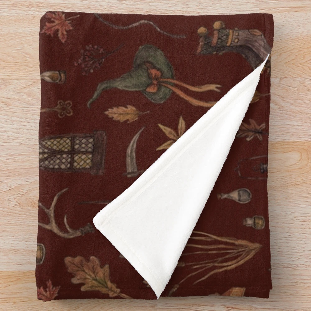 Cozy plush blanket with witchy, autumn-inspired design