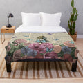 Whimsical Alice in Wonderland inspired plush blanket with vintage floral and nature motifs