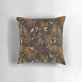 Pillow featuring a whimsical design of rabbits, ferns, and other woodland flora