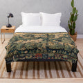 Plush blanket featuring fantasy animals and woodland creatures in an antique-inspired floral tapestry design