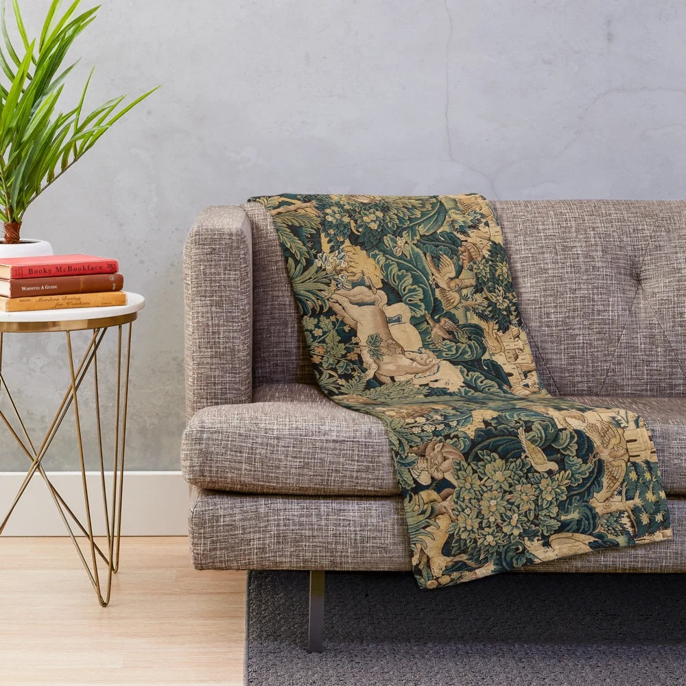 Plush blanket featuring fantasy animals and woodland creatures in an antique-inspired floral tapestry design