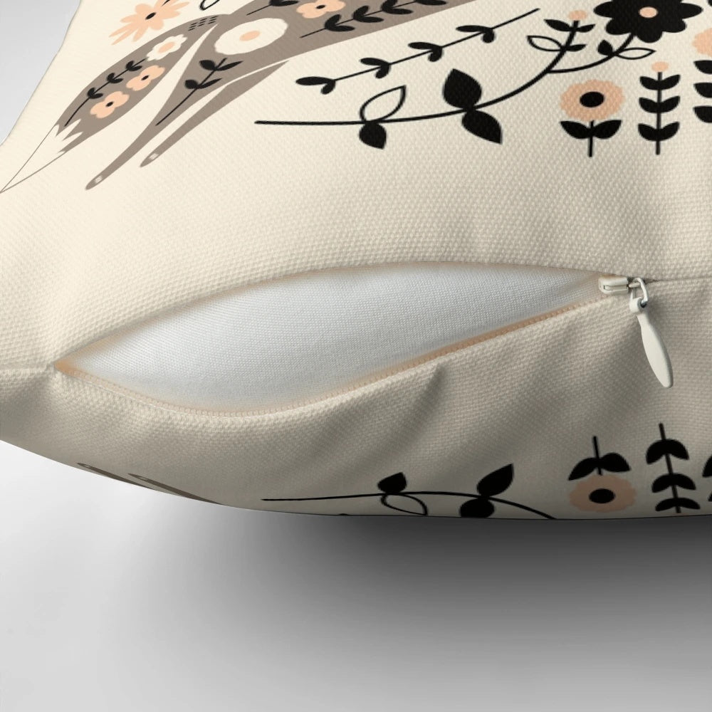 Decorative pillow featuring a whimsical forest-themed folk art design with foxes, rabbits, and birds.