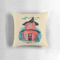 Illustrated pillow featuring a cozy woodland house surrounded by flowers and plants