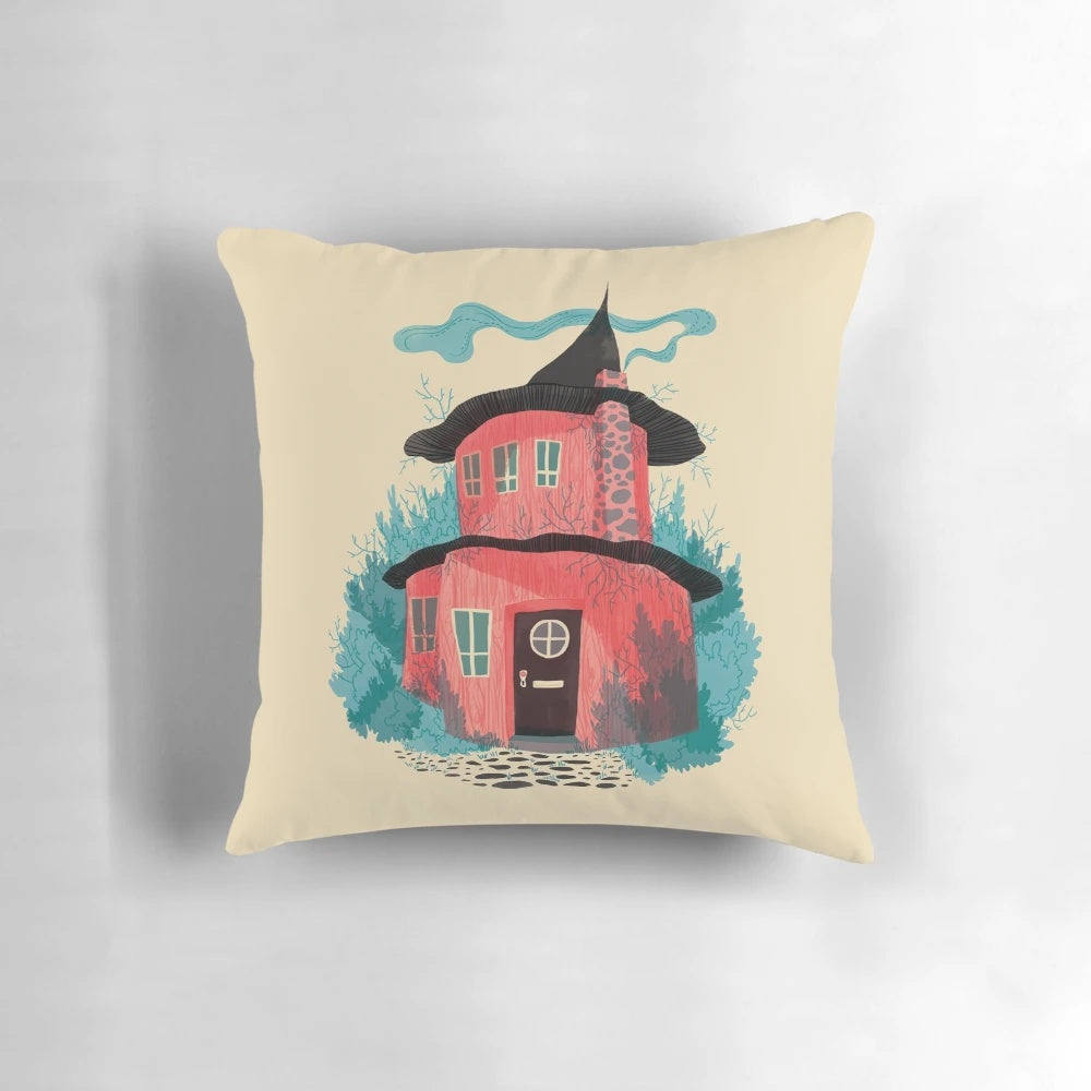 Illustrated pillow featuring a cozy woodland house surrounded by flowers and plants