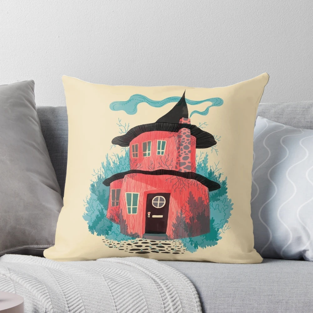 Illustrated pillow featuring a cozy woodland house surrounded by flowers and plants