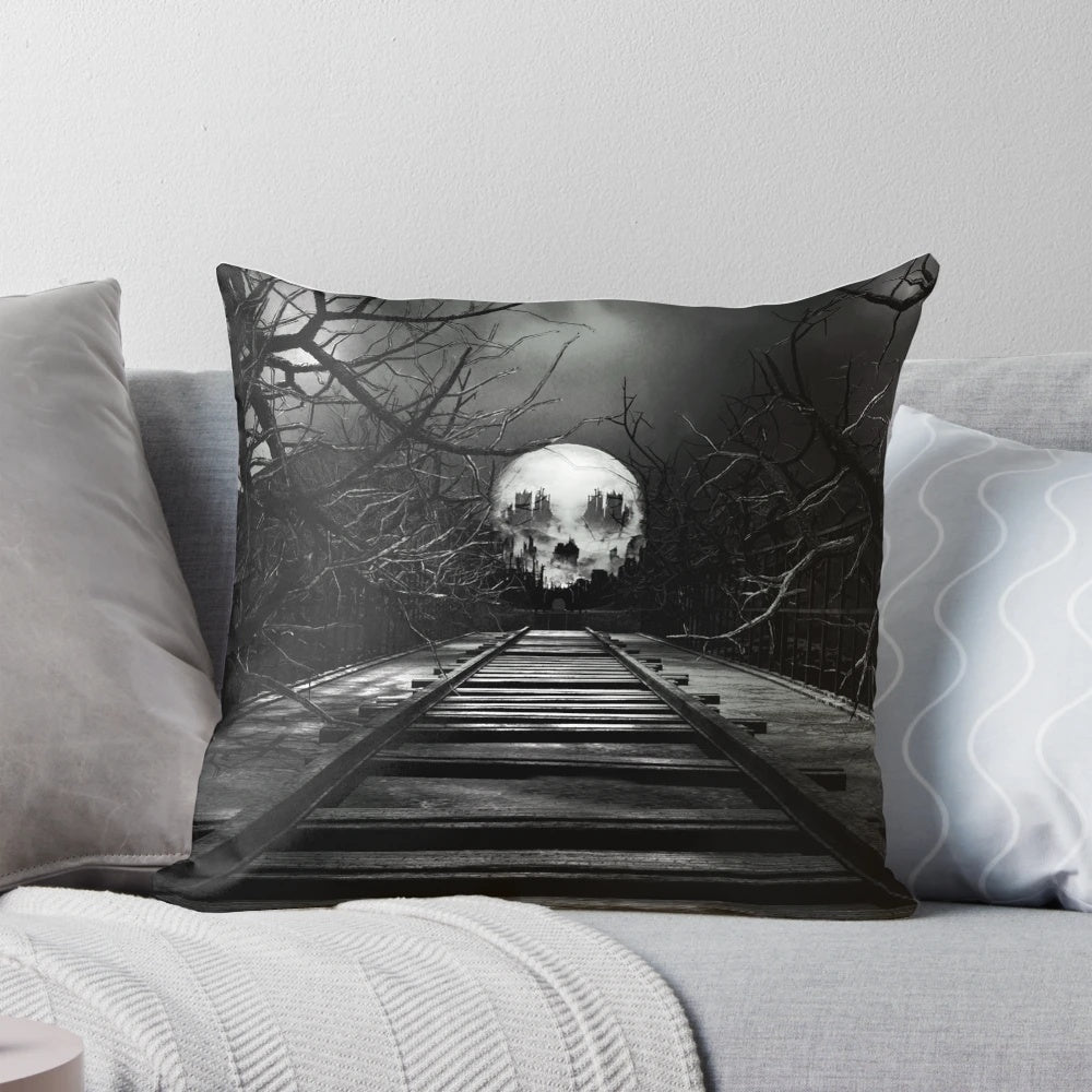 A dark and haunting pillow design featuring a gothic landscape with a skeletal figure on a railroad track under a moonlit, cloudy sky and the aurora borealis.