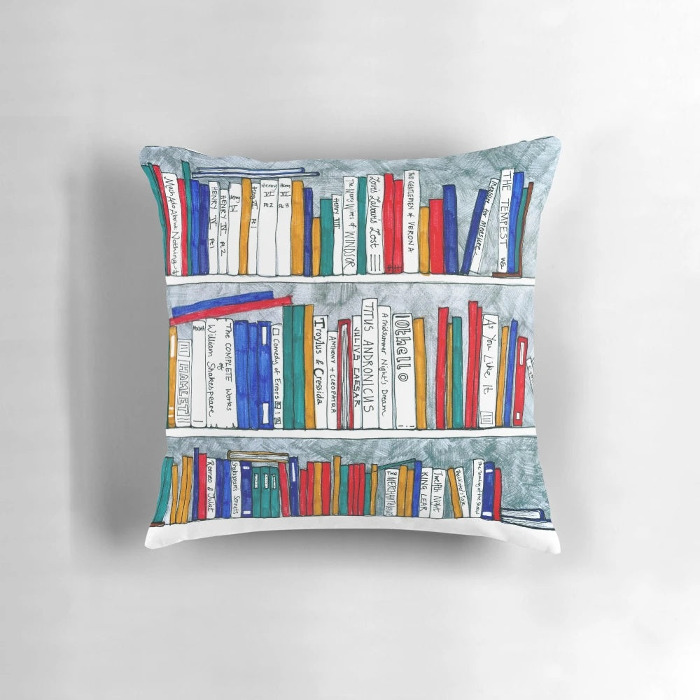 Cozy pillow featuring a bookcase design with the complete works of Shakespeare printed on the spines.