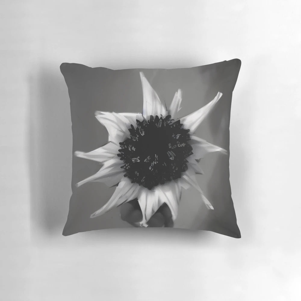 Monochromatic pillow featuring a surreal, abstract floral design with a focus on contrast and minimalist form.
