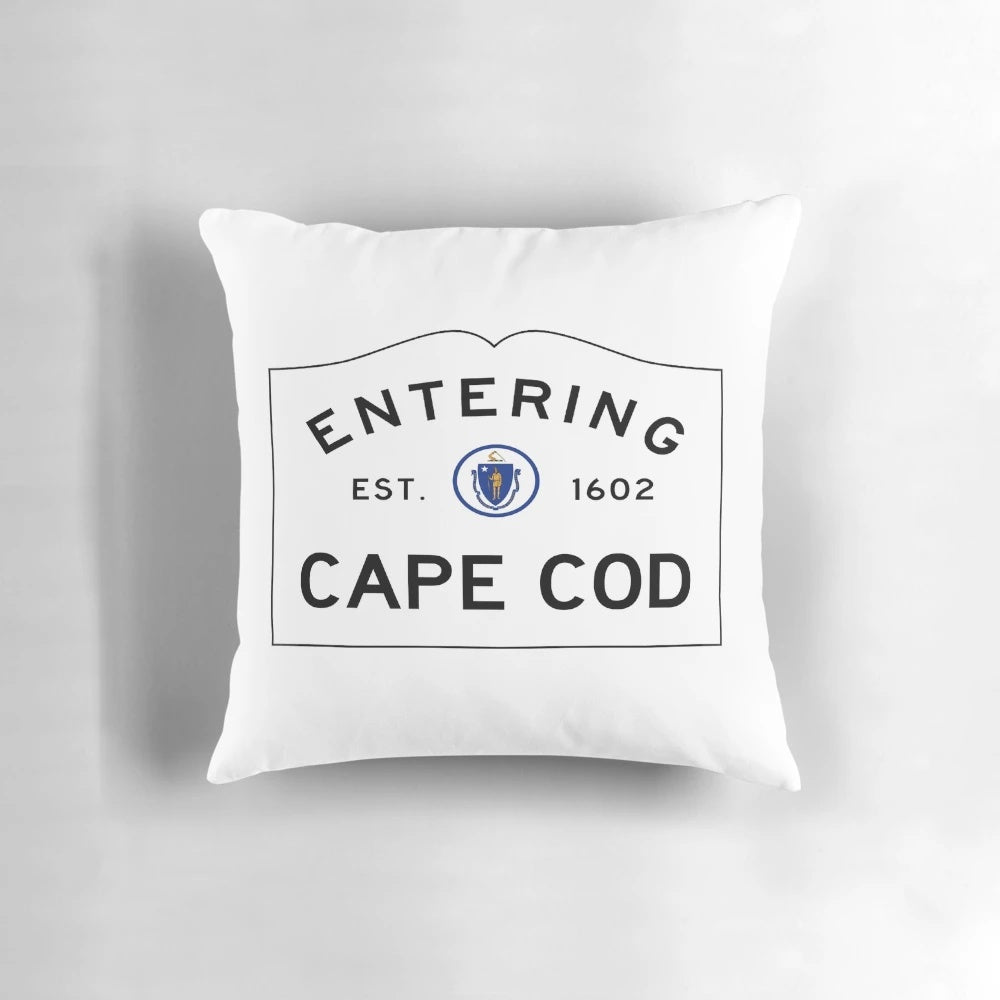 Throw pillow featuring a road sign for "Entering Cape Cod" in a coastal Massachusetts landscape.