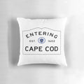 Throw pillow featuring a road sign for "Entering Cape Cod" in a coastal Massachusetts landscape.