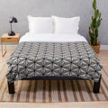 Epcot-inspired plush blanket featuring a design reminiscent of the iconic Spaceship Earth structure at Walt Disney World