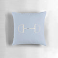 Elegant gray and silver pillow featuring a snaffle bit design, perfect for equestrian-inspired home decor.