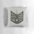 A soft, plush pillow with a design featuring an open book and the words "We Lose Ourselves in Books...