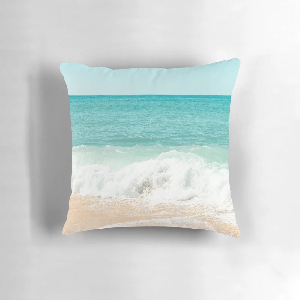 Turquoise blue ocean waves crashing on a tropical beach shore