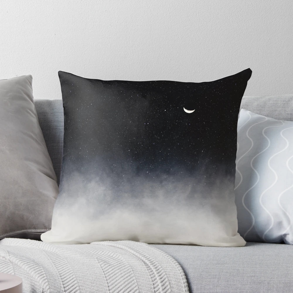 Pillow featuring a dreamy, celestial landscape design with a moon, stars, and clouds.