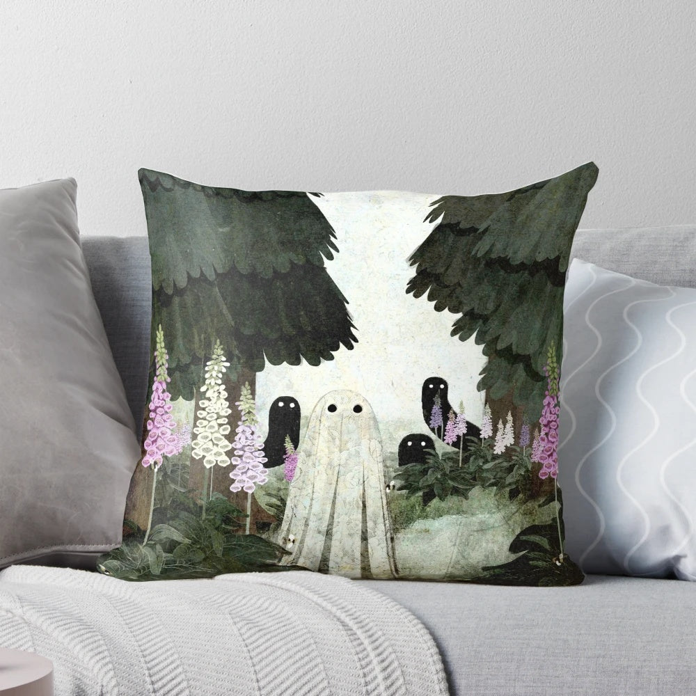 A decorative pillow featuring a ghostly, ethereal image of foxglove flowers blooming in a forested setting.