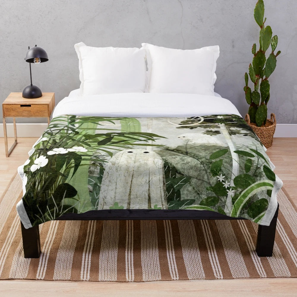 Plush blanket with ghostly greenhouse design, featuring nature elements and a whimsical, vintage-inspired style.
