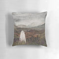 Soft, plush pillow featuring a watercolor painting of a misty, heather-covered Scottish mountain landscape with a ghostly, ethereal presence.