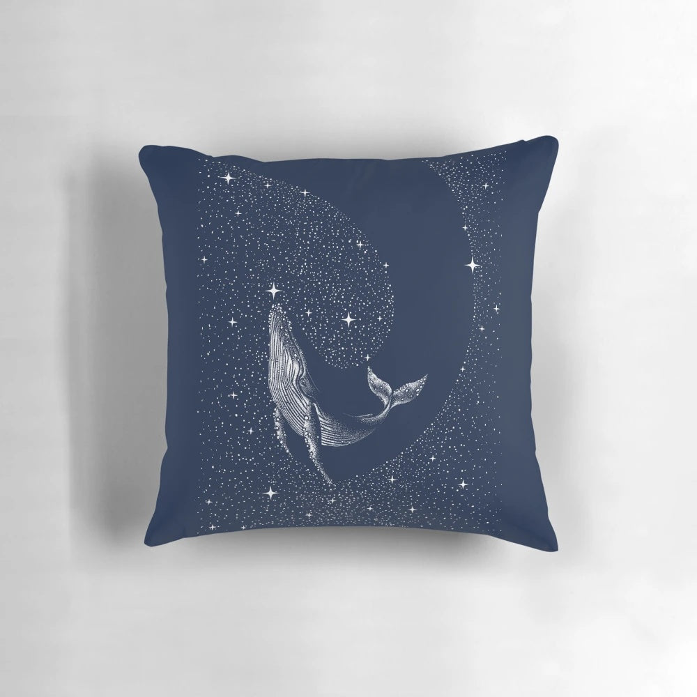 A mystical pillow featuring a humpback whale swimming among the stars in a surreal, cosmic seascape.