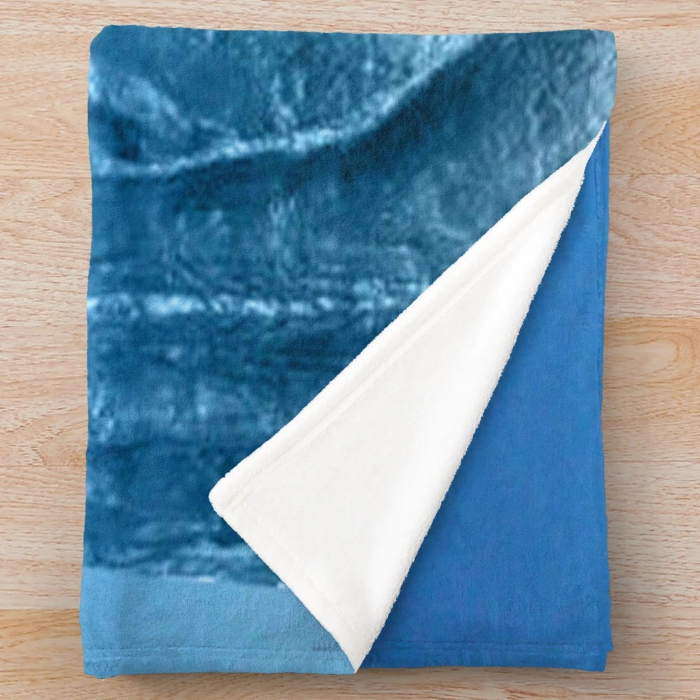 Plush blanket with an ice blue sky and abstract nature-inspired design